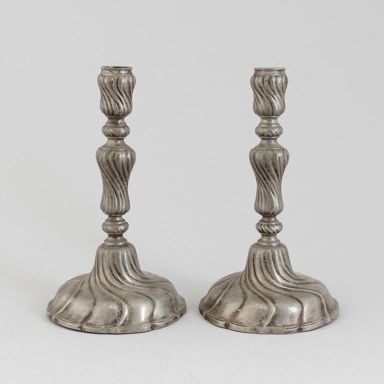 A PAIR OF ROCOCO PEWTER CANDLESTICKS, 18th century.