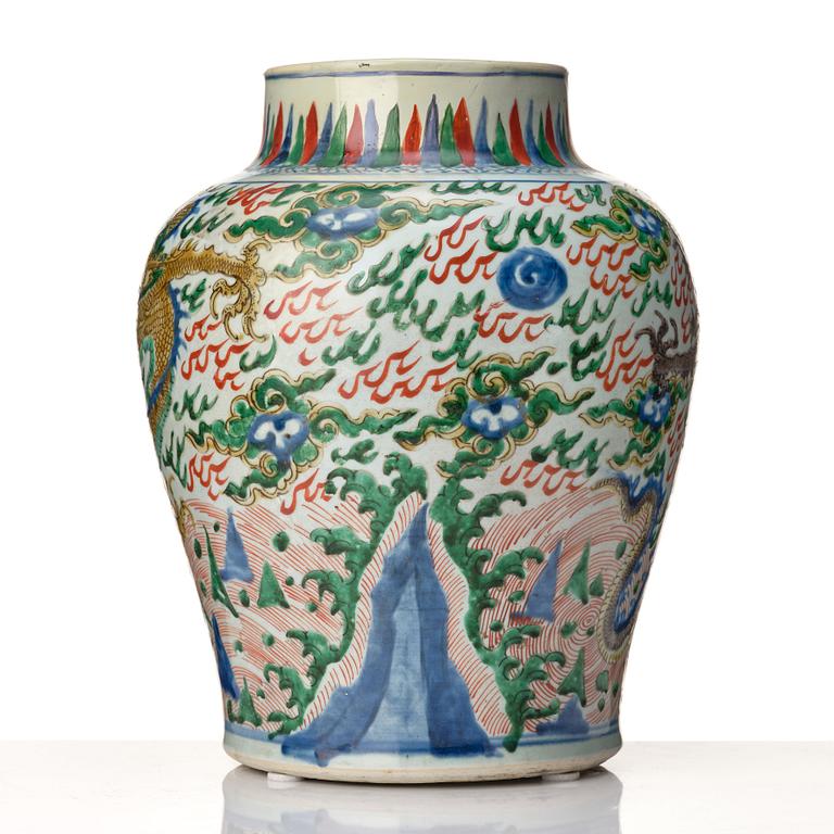 A matched pair of Transitional Wucai jars, 17th Century.