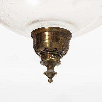 A glass and metal lantern, early 20th century.