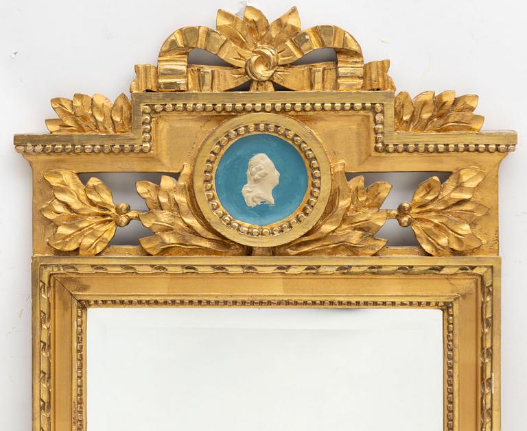 A Gustavian style mirror by John Lundmark, early 20th Century.
