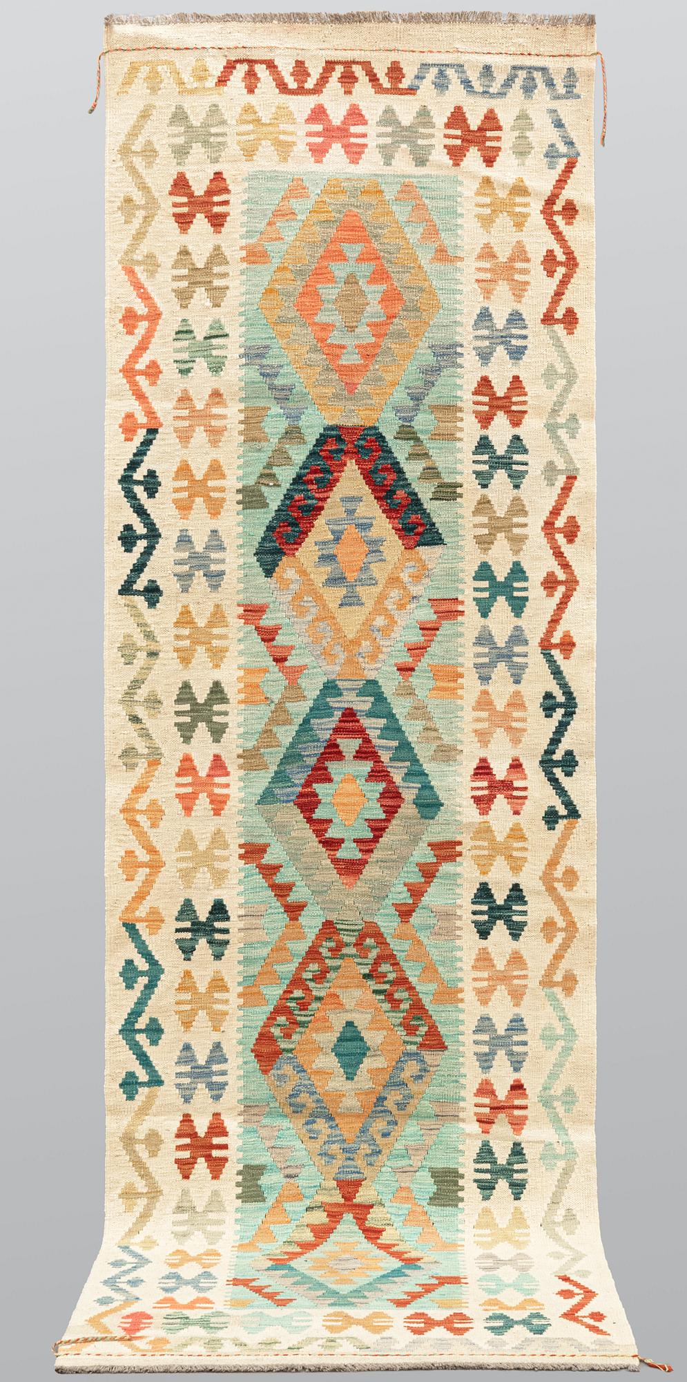 A Kilim runner, approx. 294 x 91 cm.