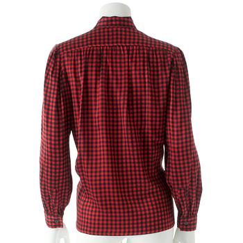 YVES SAINT LAURENT, a red and black silk blouse.