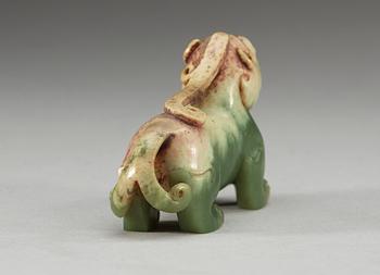 A carved nephrite figure of an archaistic buddhist lion, Qing dynasty.