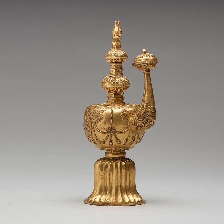 A Tibetan gilt copper bumpa, 19th Century.