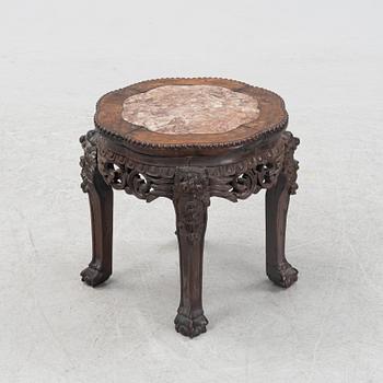A Chinese hardwood stool, 20th Century.