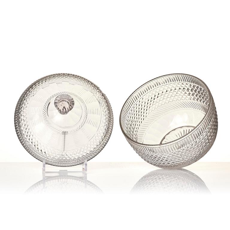 A cut glass punch bowl with cover, stand and ladle, Empire, first part of the 19th century.