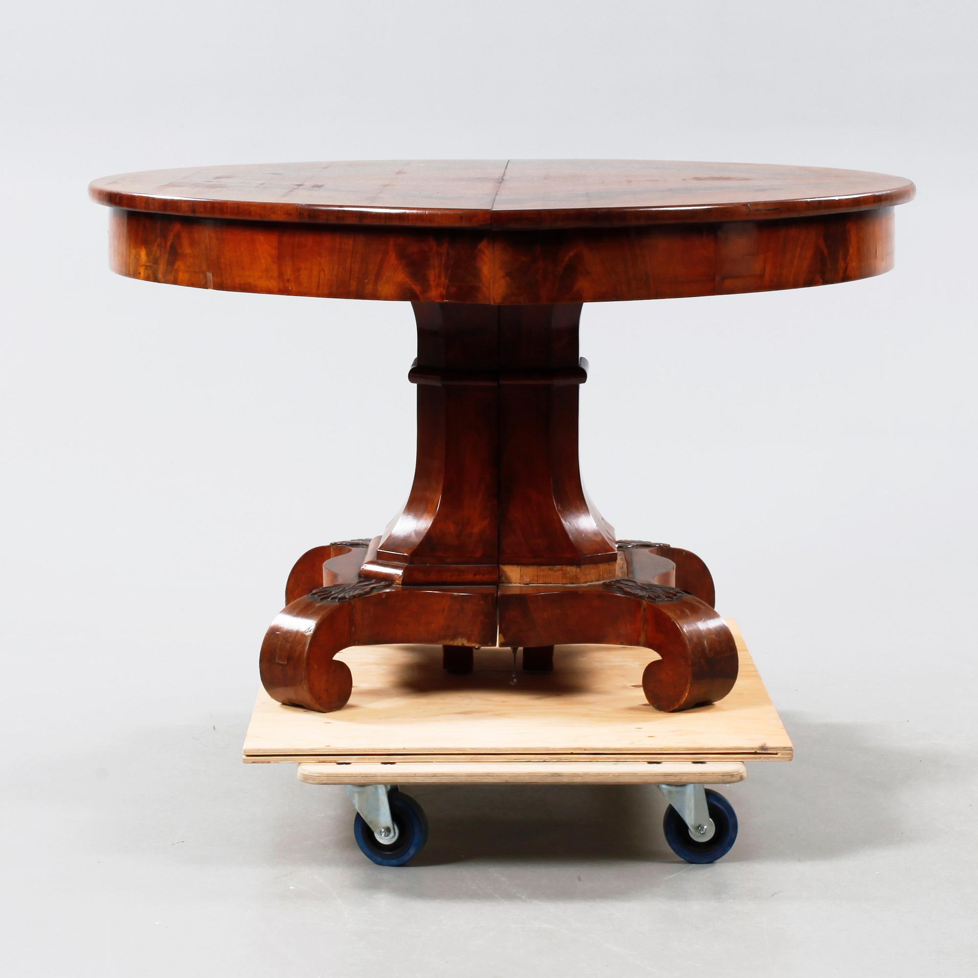 A late 19th century table with two extension leaves.