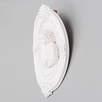 A ceramic wall relief, circa 1900.