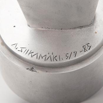An aluminium sculpture, signed and numbered 5/7, dated -85.