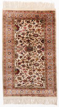 An Oriental silk rug, c. 122 x 76 cm.