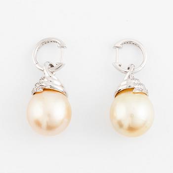 A pair of 18K white gold cultured South Sea pearl earrings.