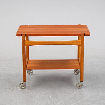 Hans J Wegner, a teak serving trolley, for för Andreas Tuck, Denmark, mid 20th century.