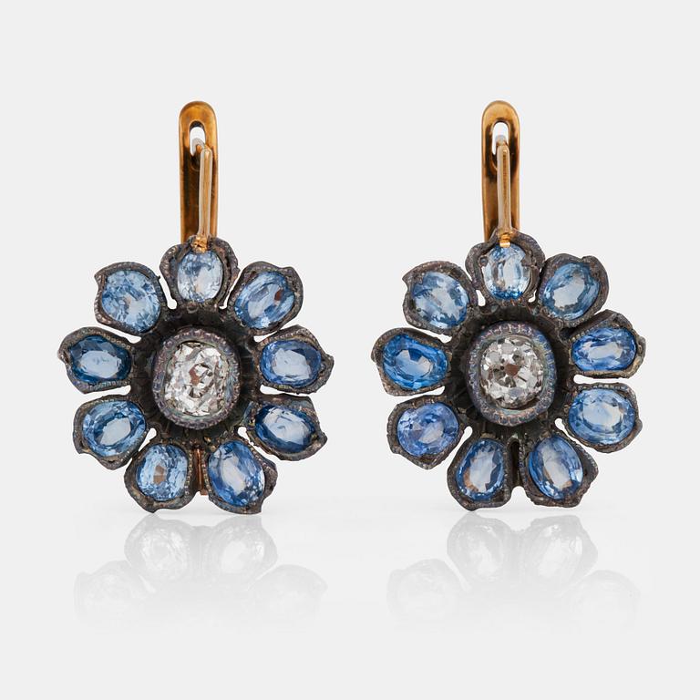 A pair of old-cut diamond and pale blue sapphire earrings. Russian setting.