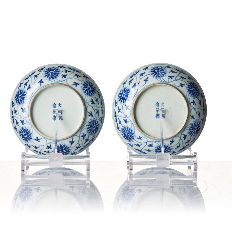 A pair of blue and white 'lotus' dishes, Qing dynasty, Tongzhi mark and of the period period (1862-74).