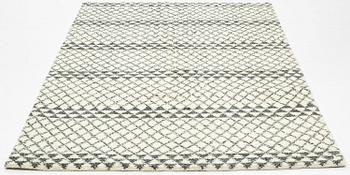 A rug of Moroccan design, ca 245 x 152 cm.
