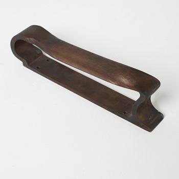 An Alvar Aalto patinated bronze handle, Valaistustyö, Artek Finland.