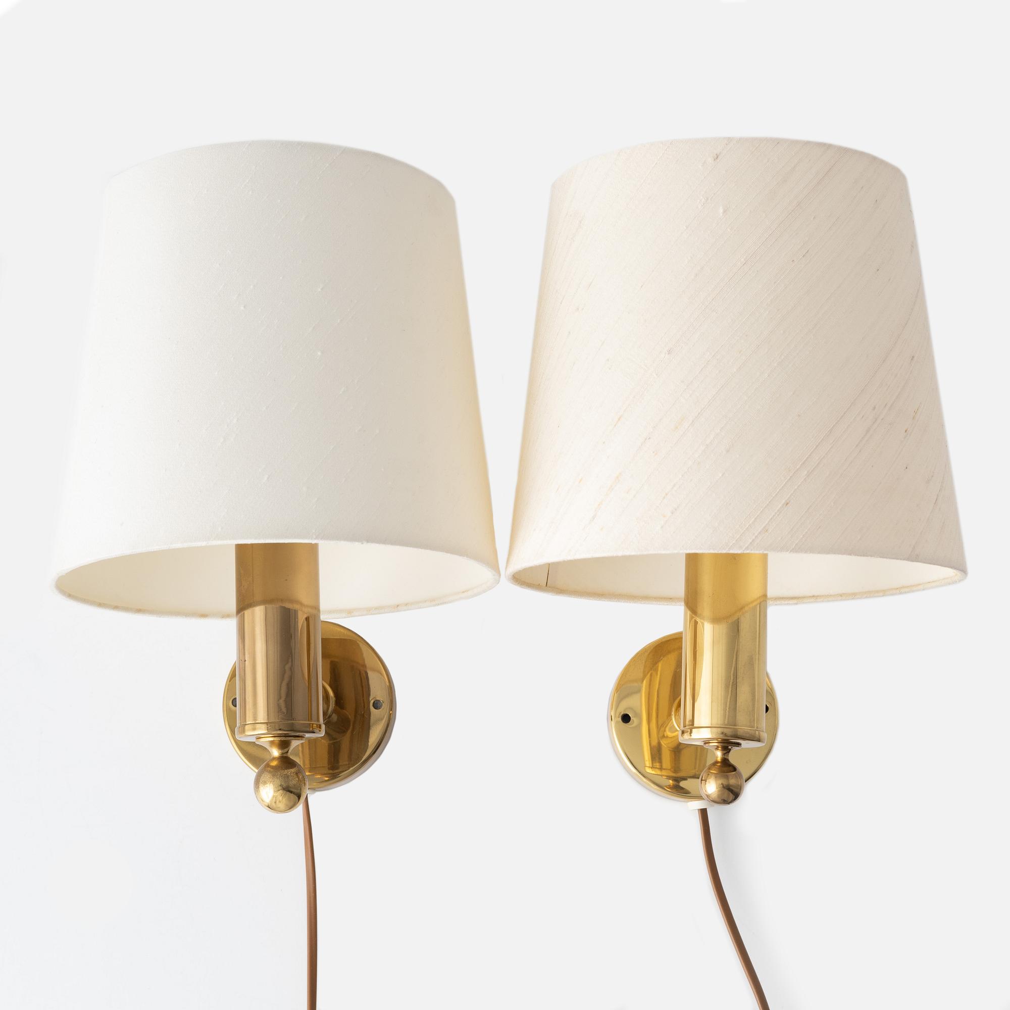 A pair of model "V-18" brass wall lamps, Bergboms, second half of the 20th century, sweden.