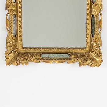 A South German Baroque carved giltwood mirror, early 18th century.