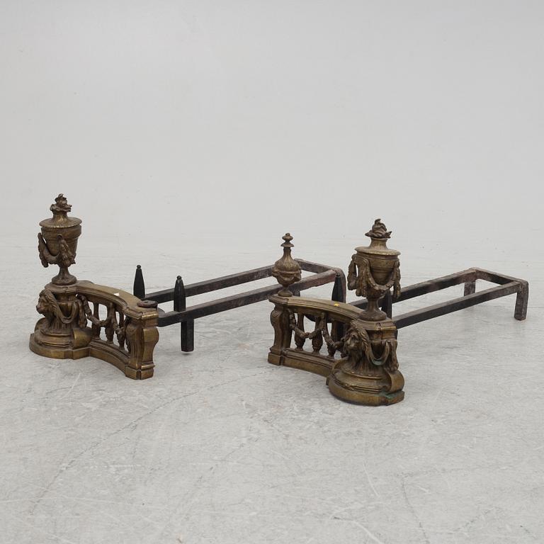 A pair of brass and forged iron andirons, late 19th century.