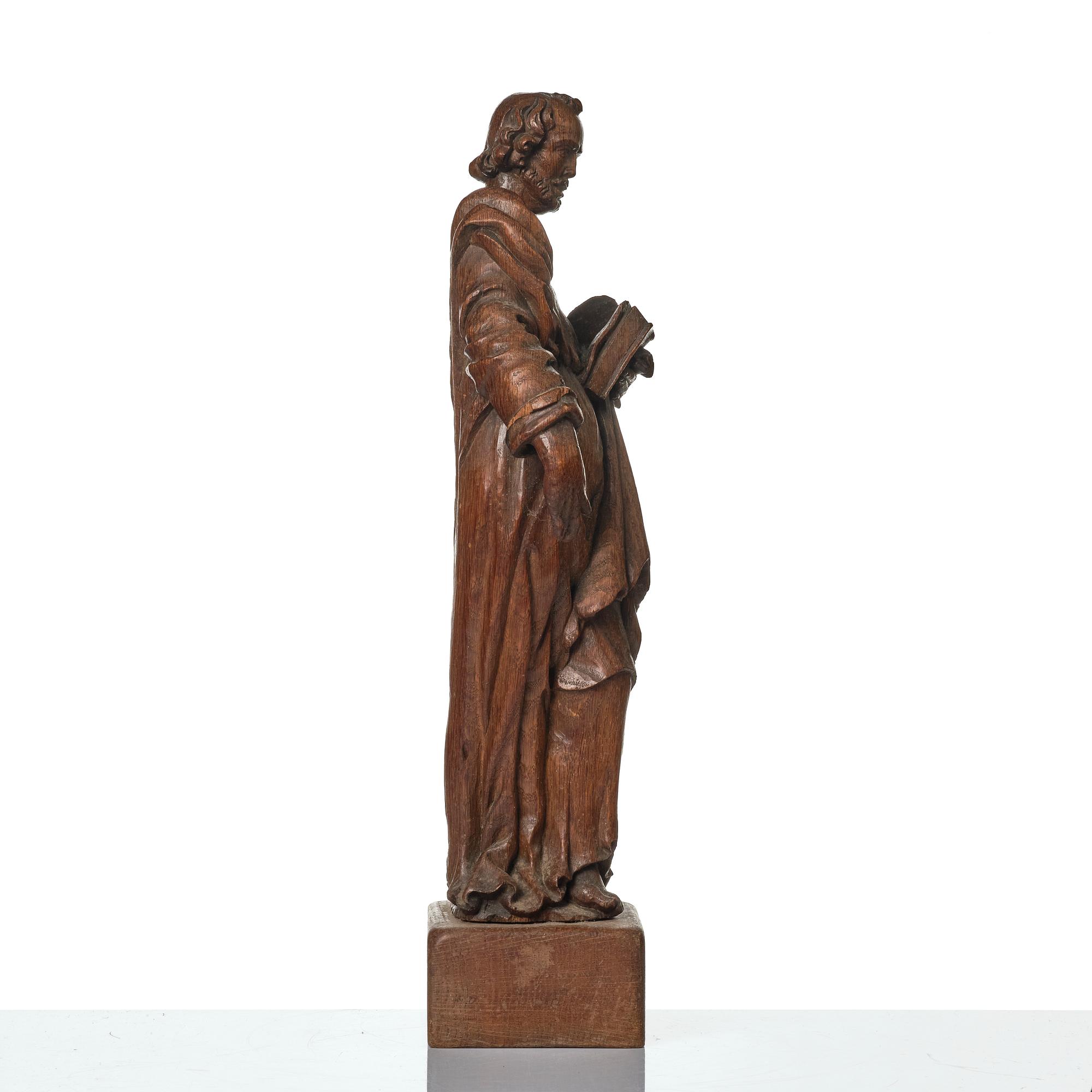 An oak sculpture of the apostle Luke, 18th/19th century.