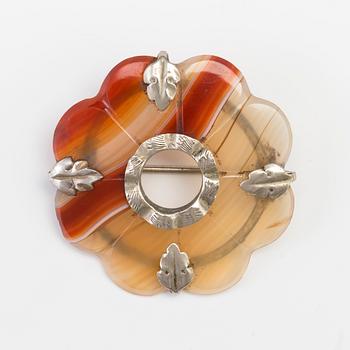 A BROOCH set with banded agate.