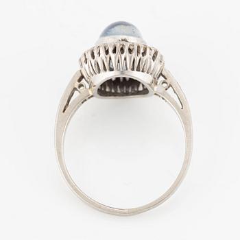 Ring, 18K white gold with cabochon-cut sapphire and octagon-cut diamonds.