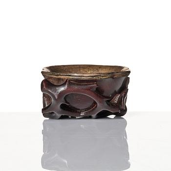 A sculptured wooden cup with silvered liner, Qing dynasty.