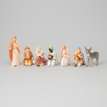 A set of 13 porcelain and wood christmas manger.