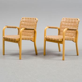 ALVAR AALTO, a pair of mode 45 leather upholstered birch armchairs from Artek, Finland.