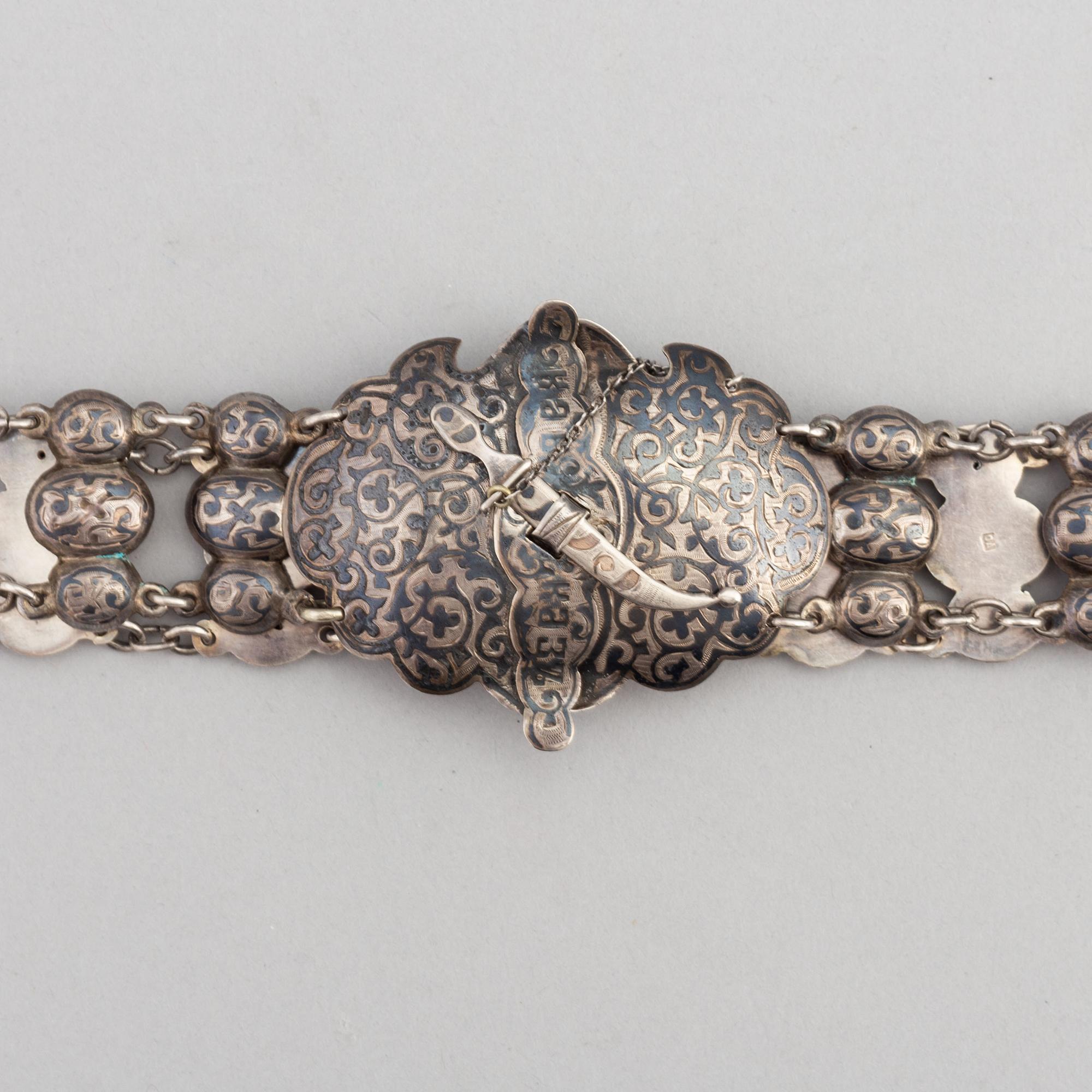 A Russian silver niello belt, circa 1900. Swedish import mark.