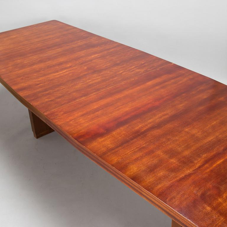 A mid 20th century conference table / dinner table marked Paul Boman.