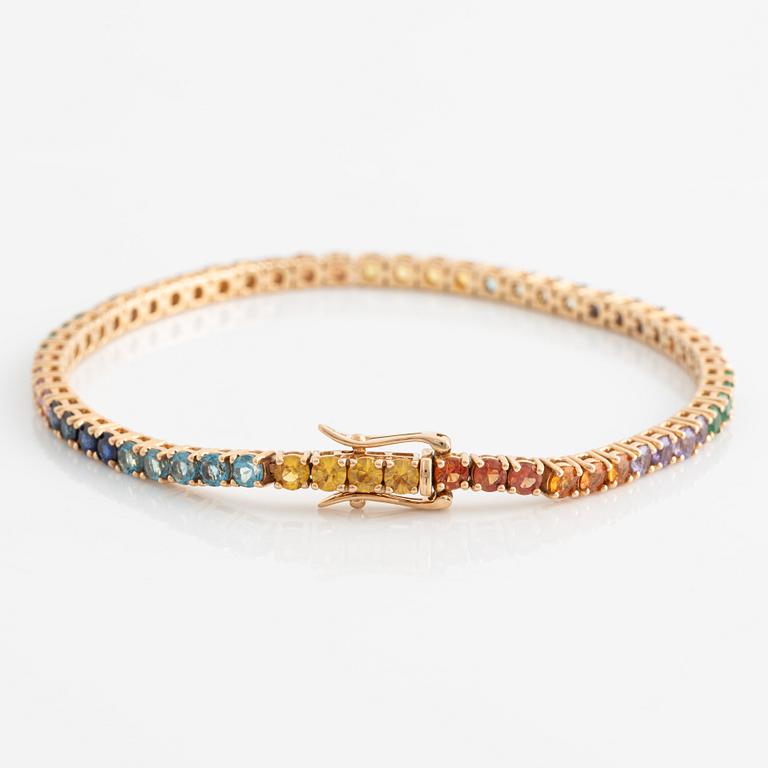 Bracelet 18K gold with faceted emeralds and sapphires in various colors.