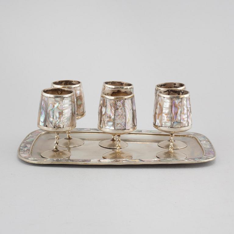 Six liqeur glasses on a tray, mother of pearl and alpaca, Mexico, second half of the 20th century.