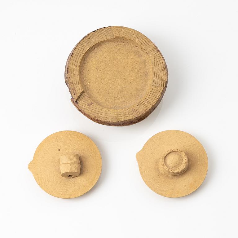 A group of three bright yellow yixing 'Gongfu' teapots, China, 1990s.