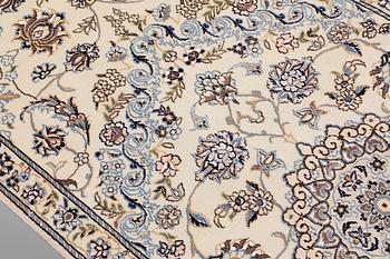 A Nain part silk runner carpet, 311 x 88 cm.