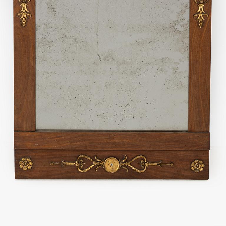 A mahogany Empire mirror, by J. Frisk (active 1805-1824).