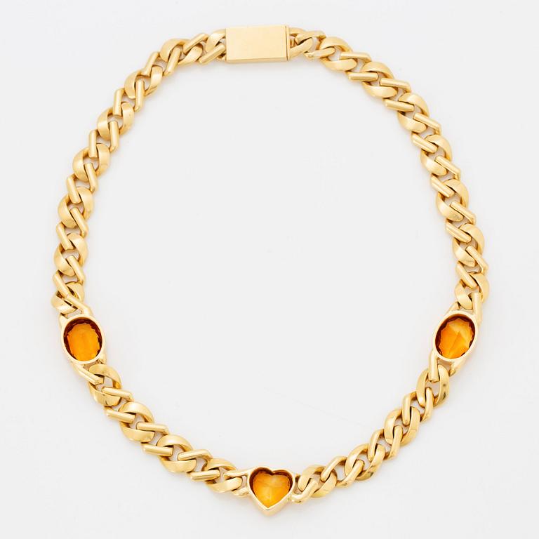 An 18K gold necklace set with faceted citrines.