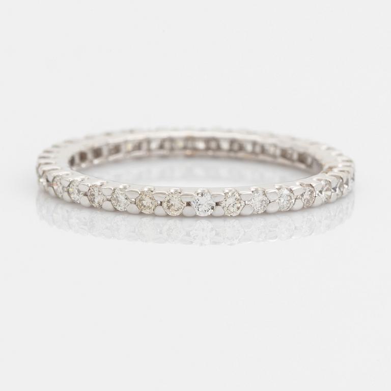 Brilliant-cut diamond eternity ring.