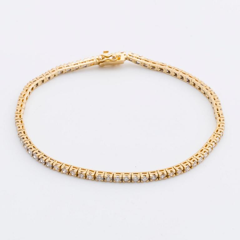 TENNISARMBAND 18K guld med 70 briljanter ca 3 ct totalt.