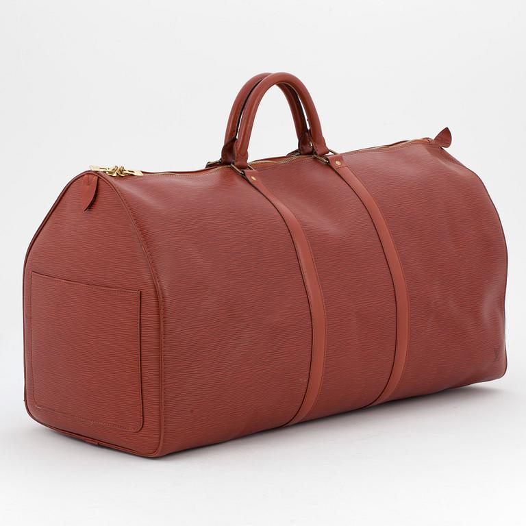 LOUIS VUITTON, a brick red epi weekend bag, "Keepall 60".