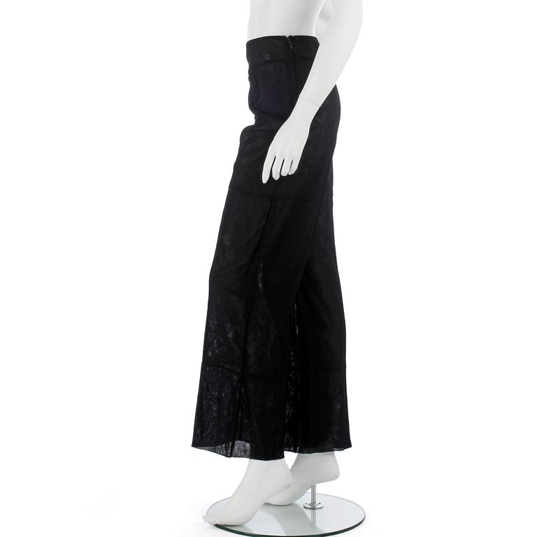 CHANEL, a black mesh evening pant.