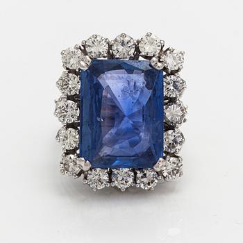 A platinum ring with a ca. 18.00 ct sapphire and ca. 3.00 cts of diamonds. With certificates.