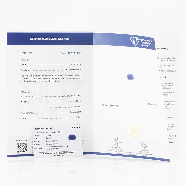 Ring, Fred Leighton platinum with an oval faceted tanzanite and fancy-cut diamonds.