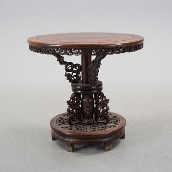 A Chinese wooden table, early 20th century.