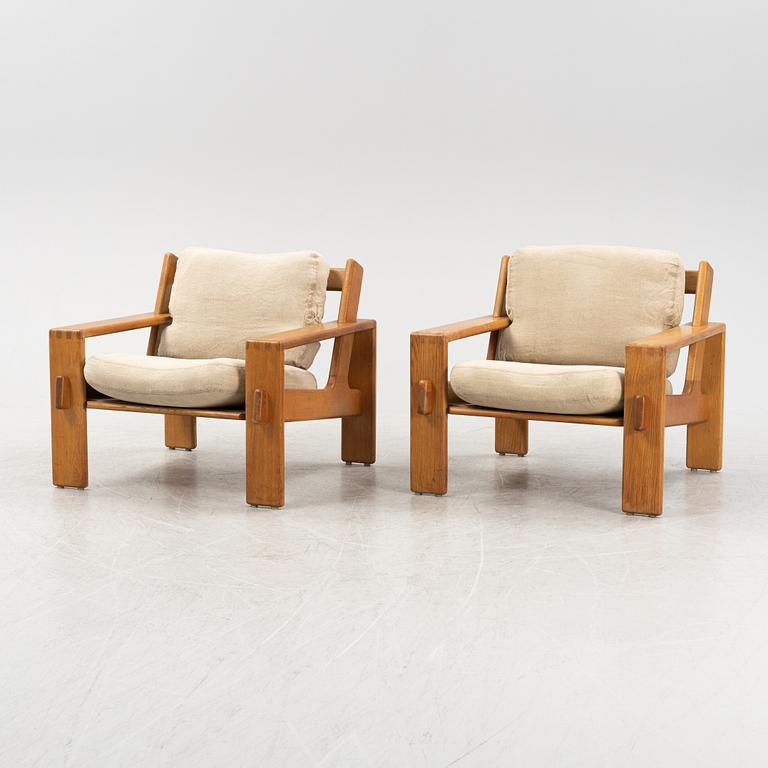 Esko Pajamies, a pair of oak 'Bonanza' lounge chairs from Asko, 1970's.