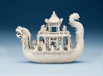 1802. A white bisciut Dragon Boat, 19th Century.