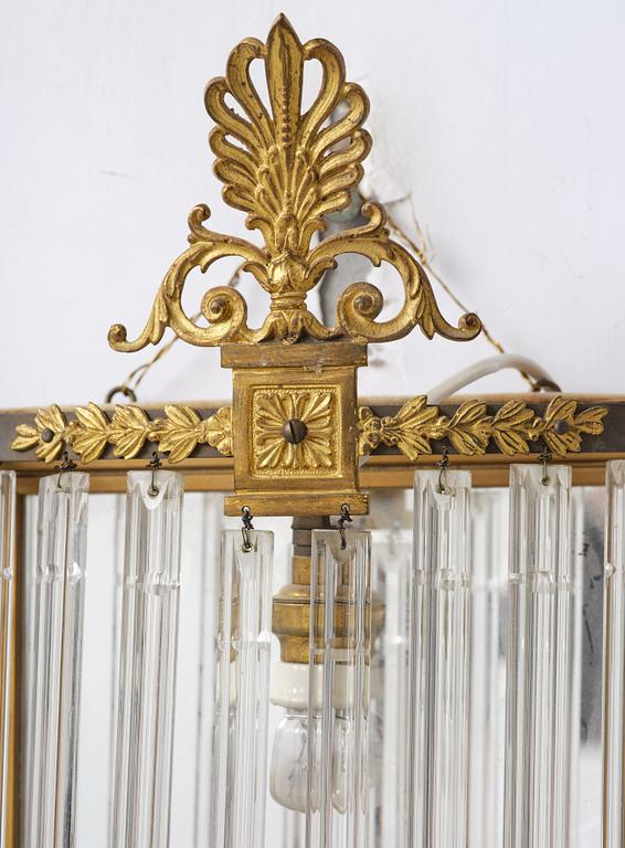 A pair of mirror sconces, 1910's/20's.