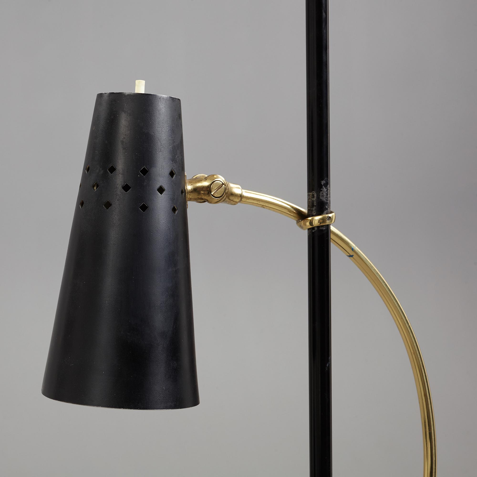 A Swedish Modern brass and black lacquered floor lamp, 1950's.