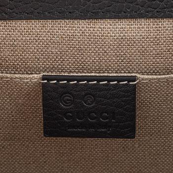 Gucci, a black leather 'Interlocking G' bag.