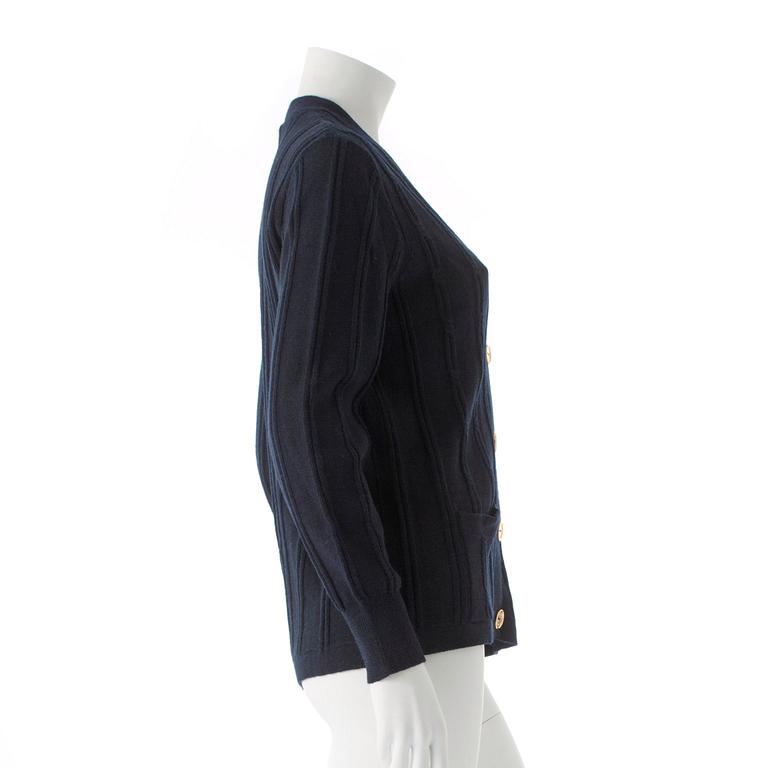 CÉLINE, a dark blue wool cardigan.